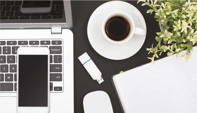 Desk with macbook, iphone, and a cup of coffee